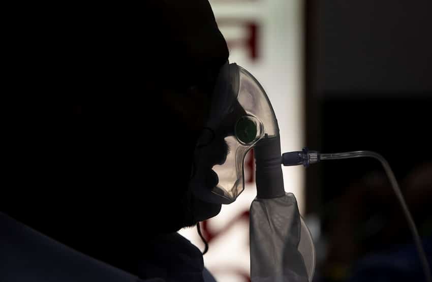 A patient suffering from the coronavirus disease (COVID-19) receives treatment inside the emergency ward at Holy Family hospital in New Delhi